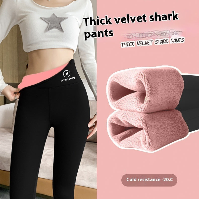 a woman wearing black pants