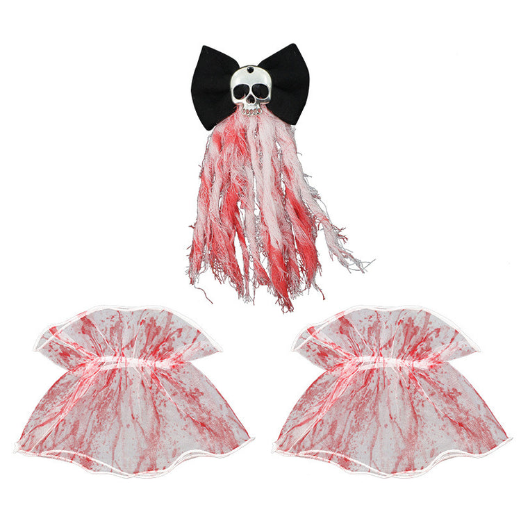 a skull and a bow with red and white threads