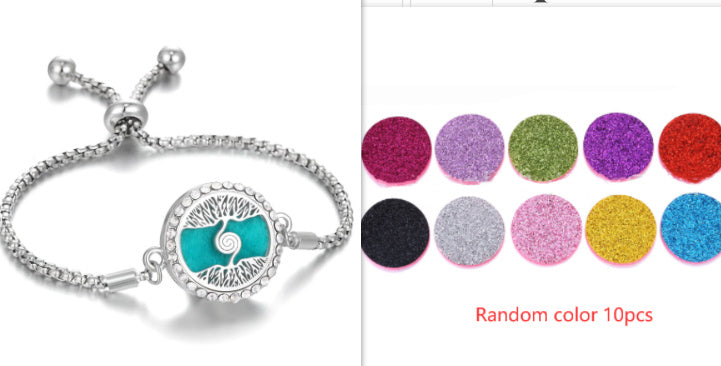 a bracelet with a tree of life and a row of different colors