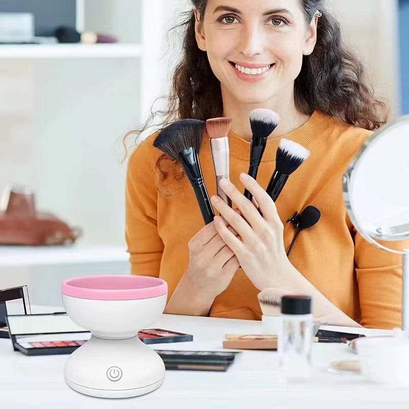 a woman holding a set of makeup brushes