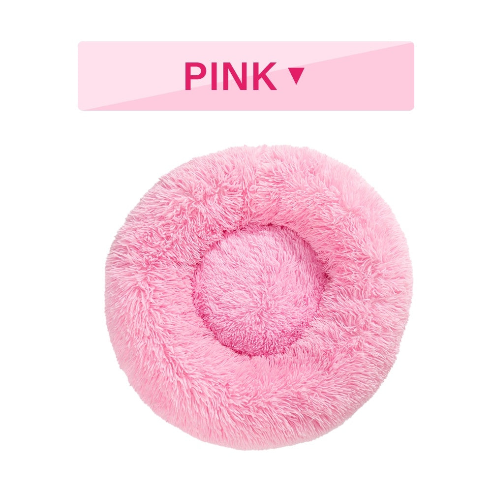 a pink fluffy pillow with text