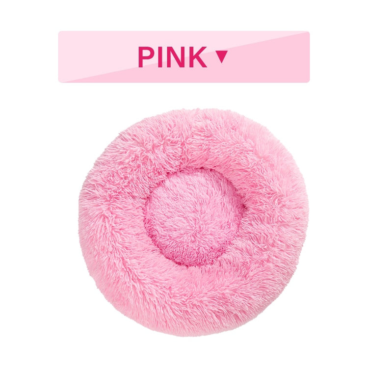 a pink fluffy pillow with text