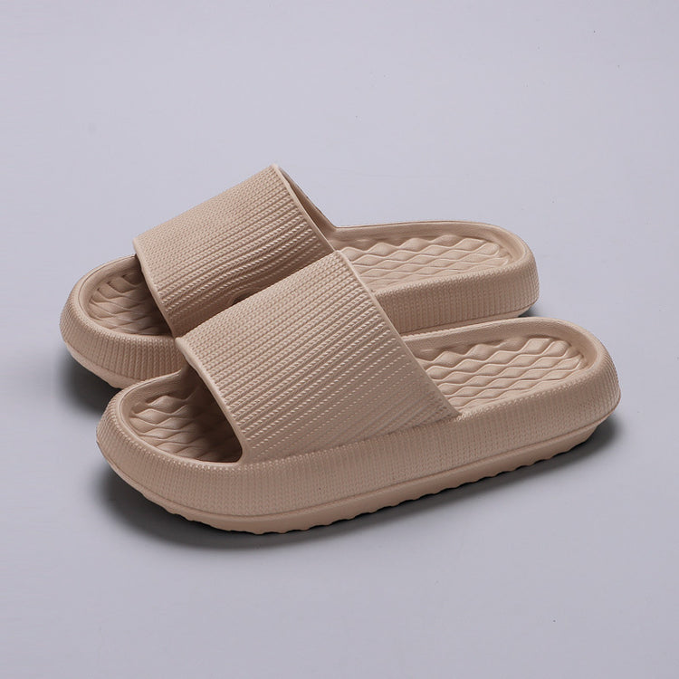 a pair of beige slippers