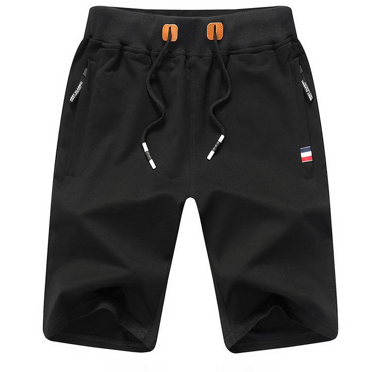 a black shorts with orange straps