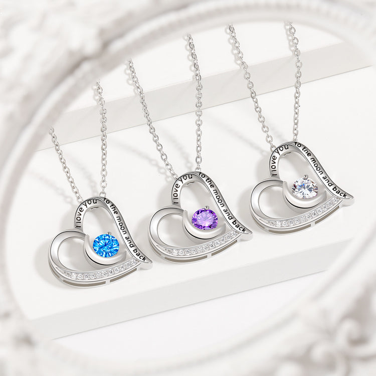 a group of necklaces with a gem in the shape of a heart