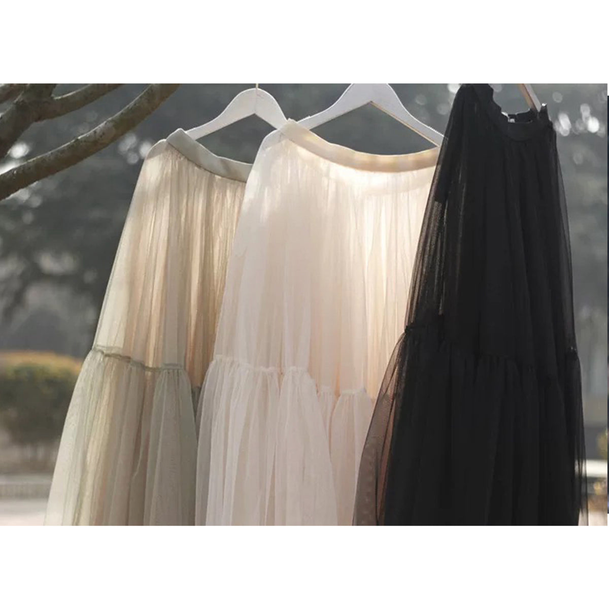 a group of dresses on a tree