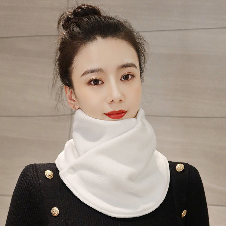 a woman with a white scarf around her neck