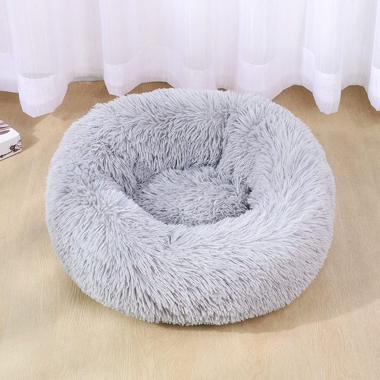 a grey furry dog bed