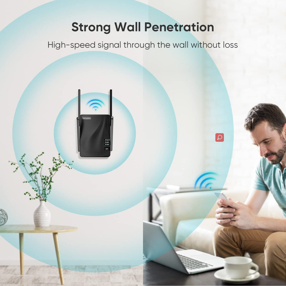 a man sitting on a couch looking at a device