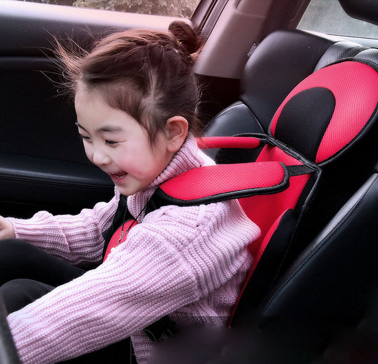 a girl in a car seat