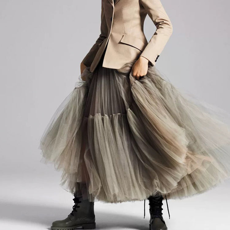 a woman in a tulle skirt and boots