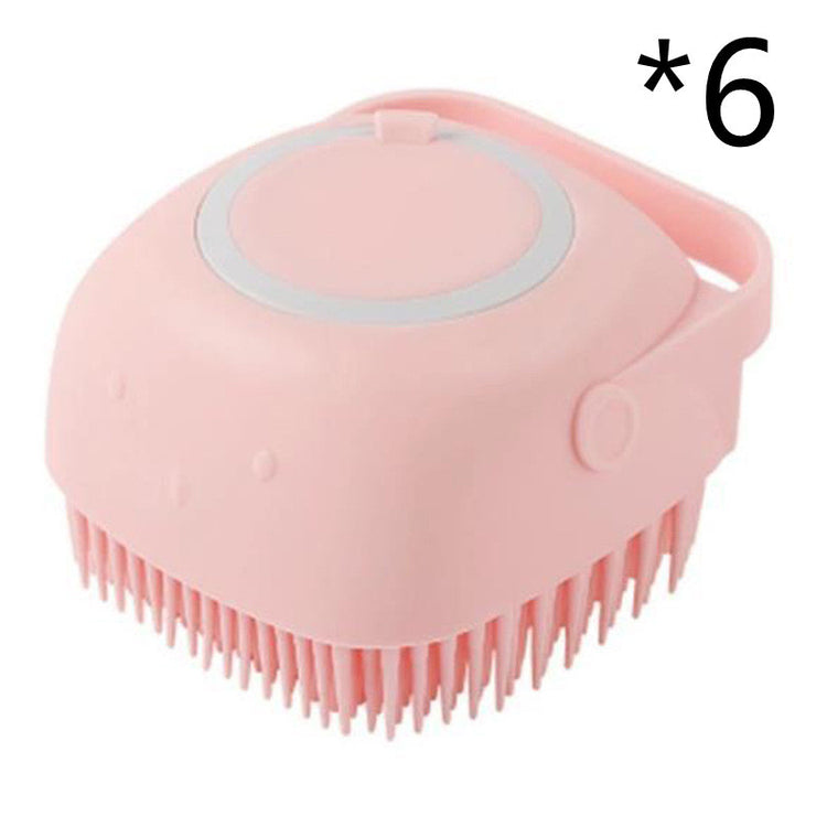 a pink brush with a handle