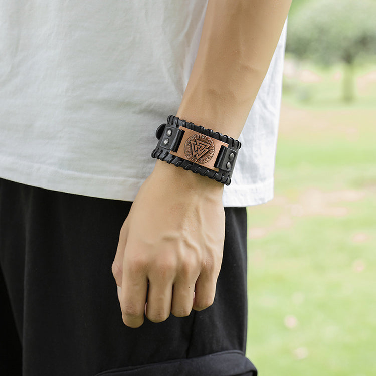 a person wearing a leather bracelet