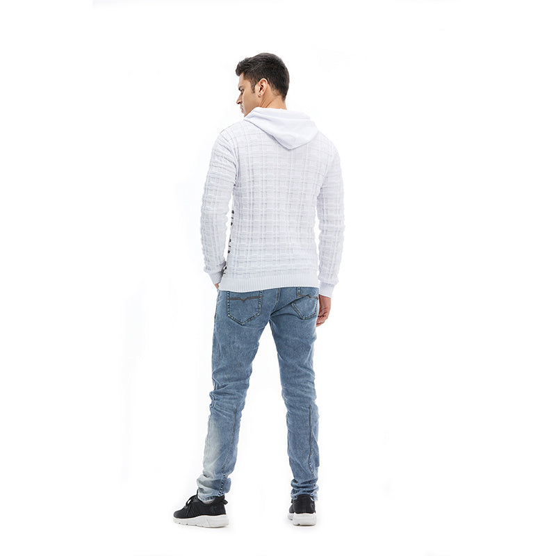a man in a white sweater