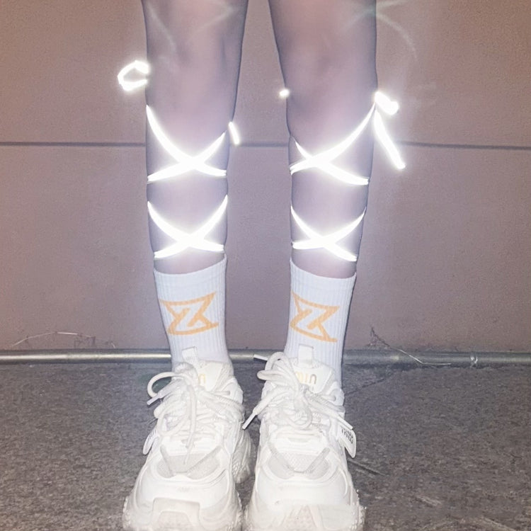 a person wearing white socks and white socks with white socks and white shoes