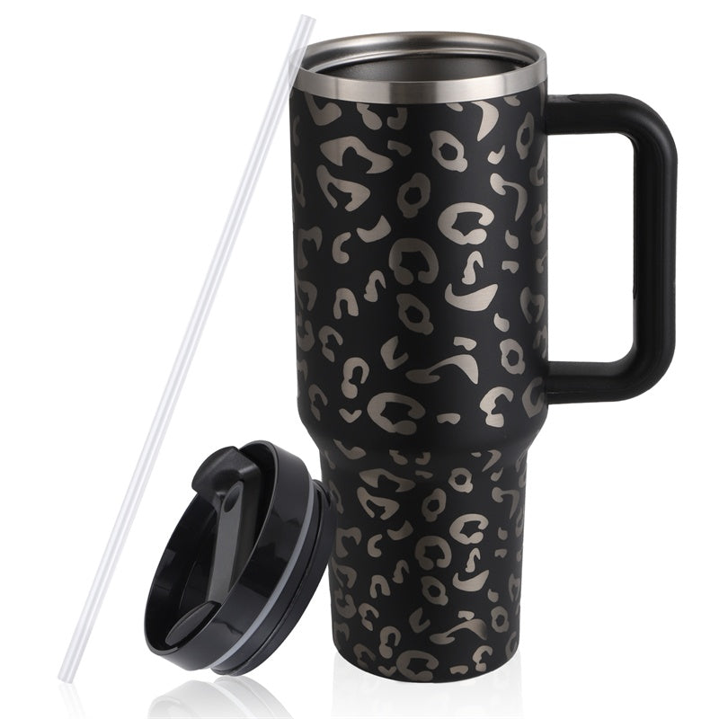 a black and silver coffee mug with a straw