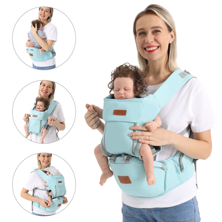 a woman holding a baby in a baby carrier