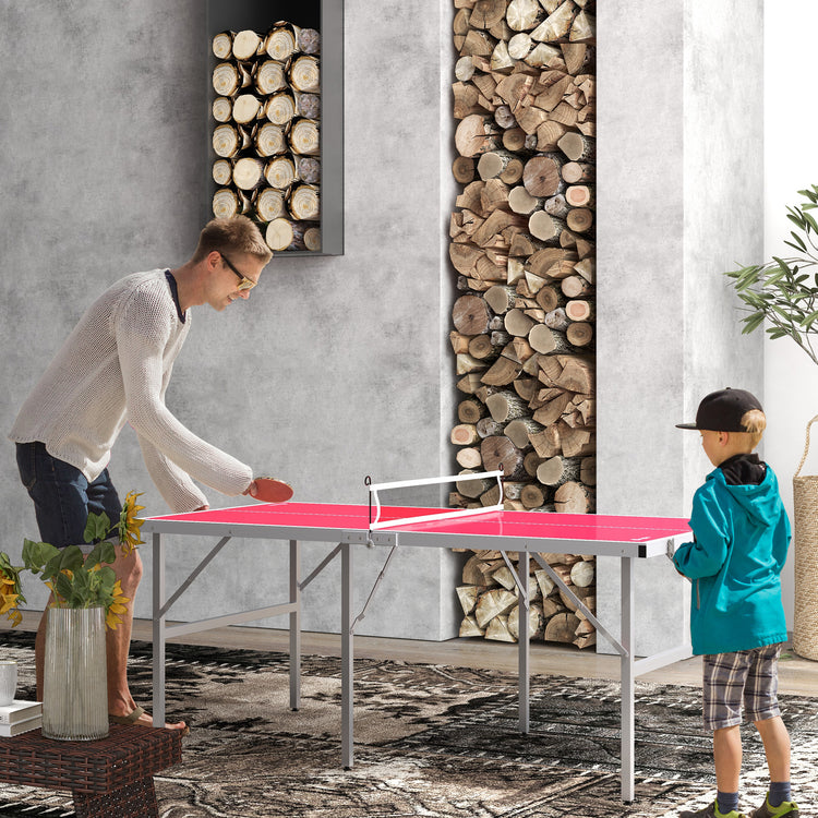 a man and boy playing ping pong