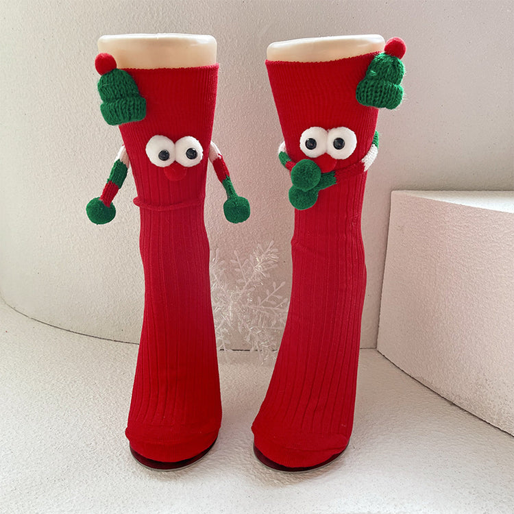 a pair of red socks with eyes and nose