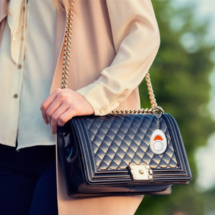 a woman holding a black purse