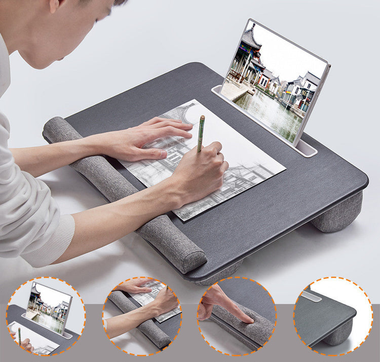 a man drawing on a tablet