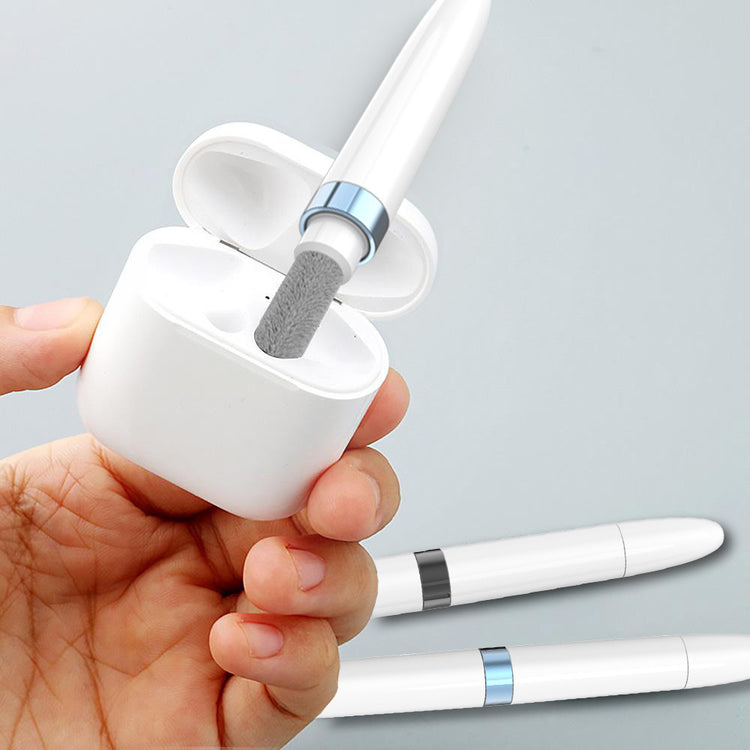 a hand holding a white device