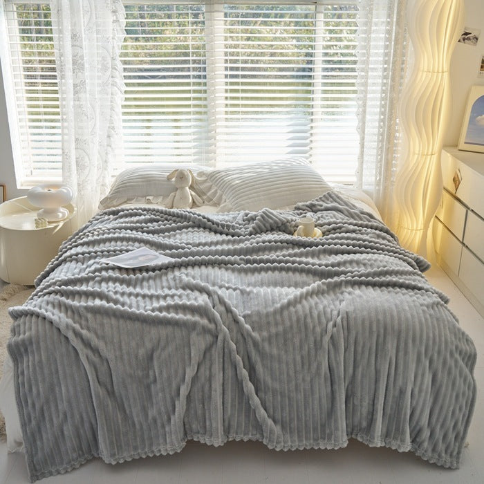 a bed with a blanket and pillows