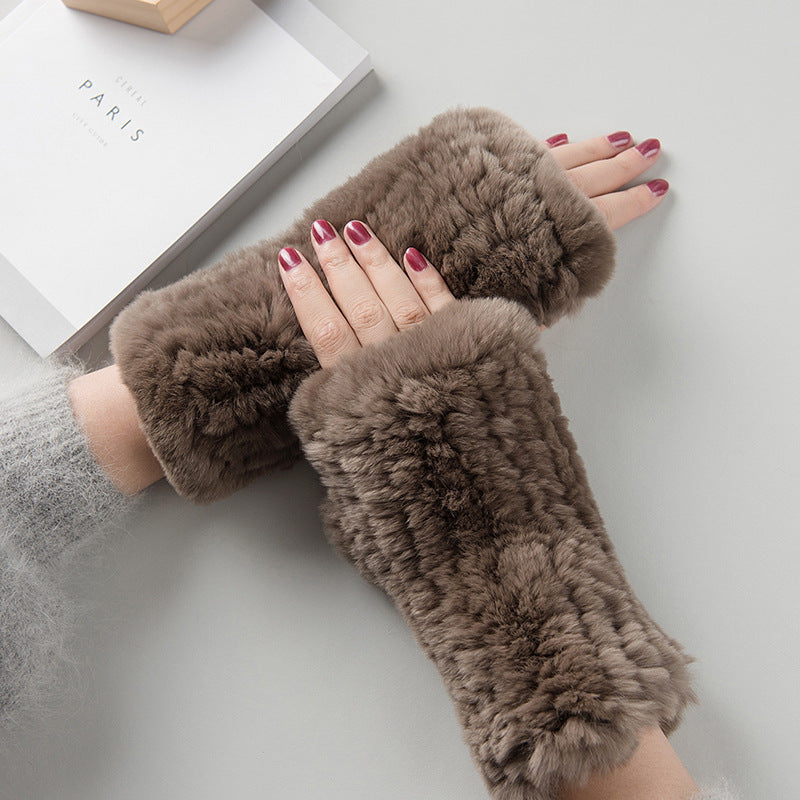 a person wearing furry gloves