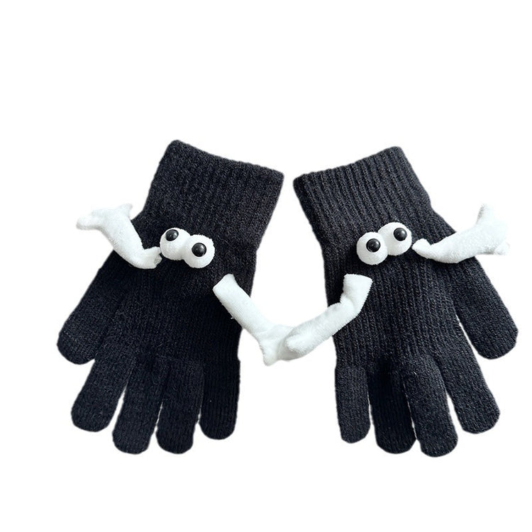 a pair of black gloves with white eyes and mustaches
