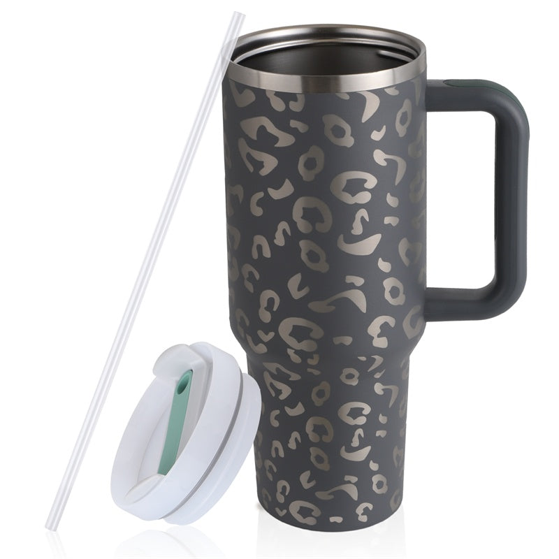 a black and grey coffee mug with a straw and a white lid