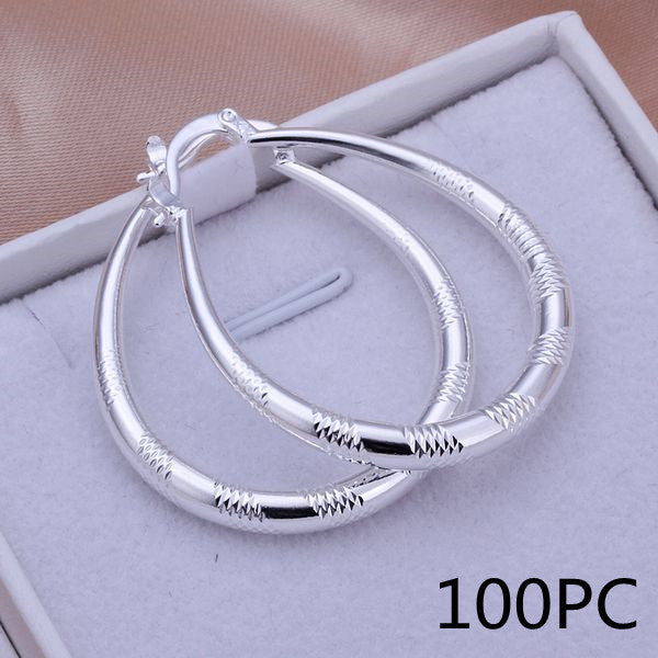a pair of earrings in a box