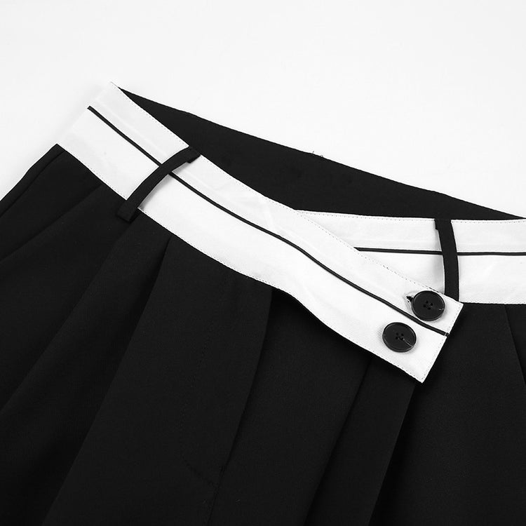 a black and white skirt with buttons