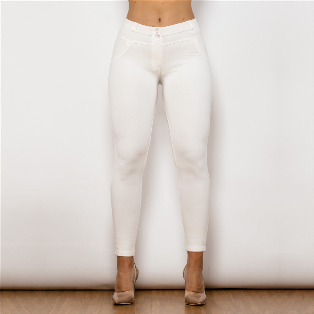 a woman wearing white pants