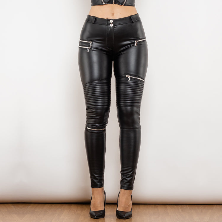 a woman wearing black leather pants