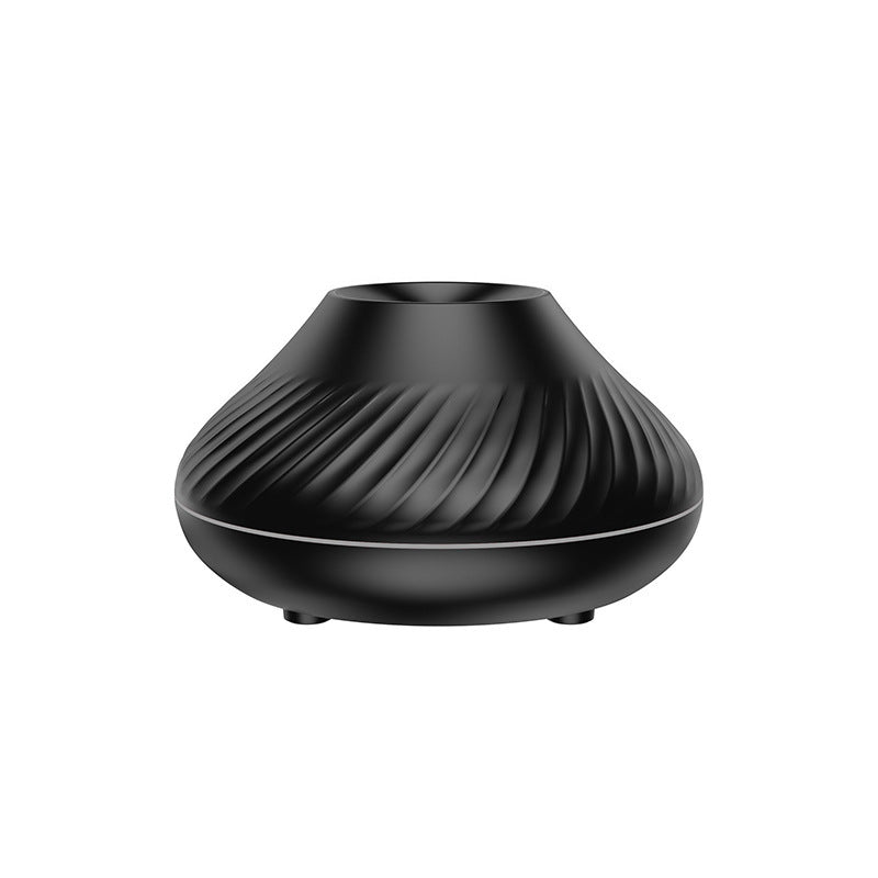 a black round object with a curved design