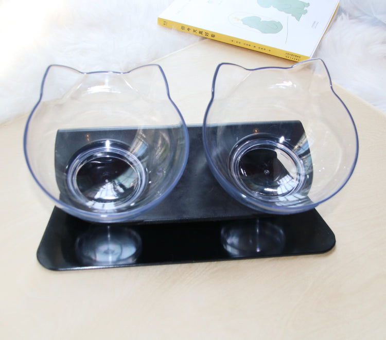 two clear bowls on a black stand