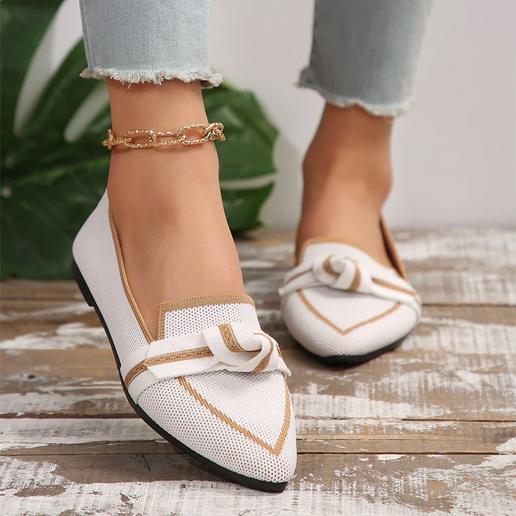 a person wearing white shoes