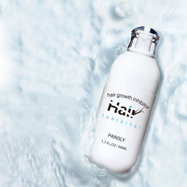 a white bottle of hair growth in water