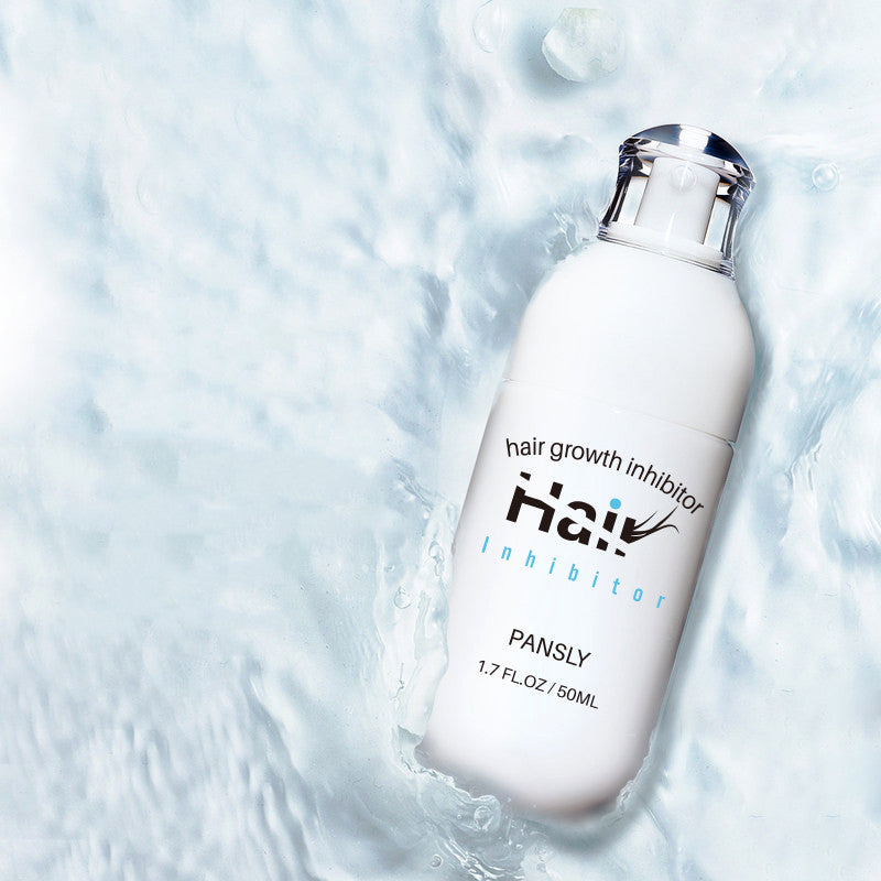 a white bottle of hair growth in water