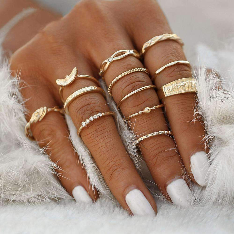 a hand with many rings on it