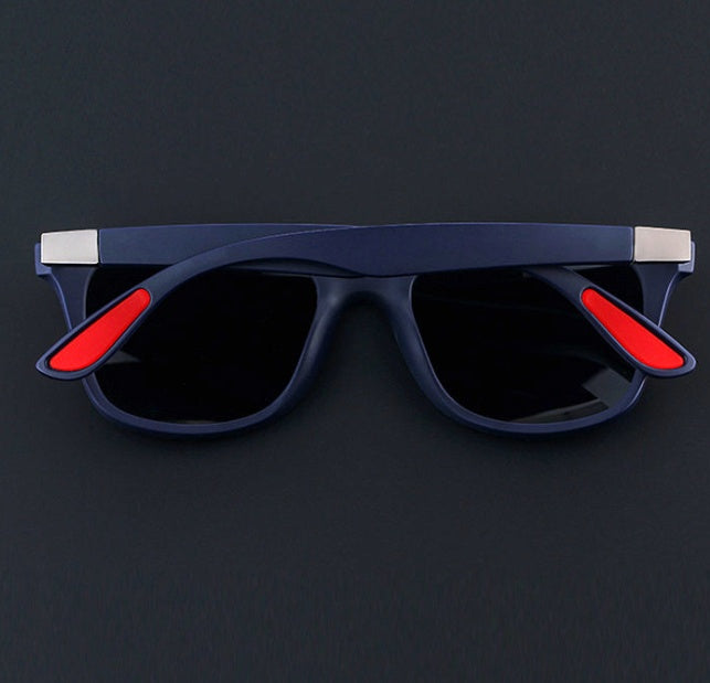 a pair of sunglasses on a black surface