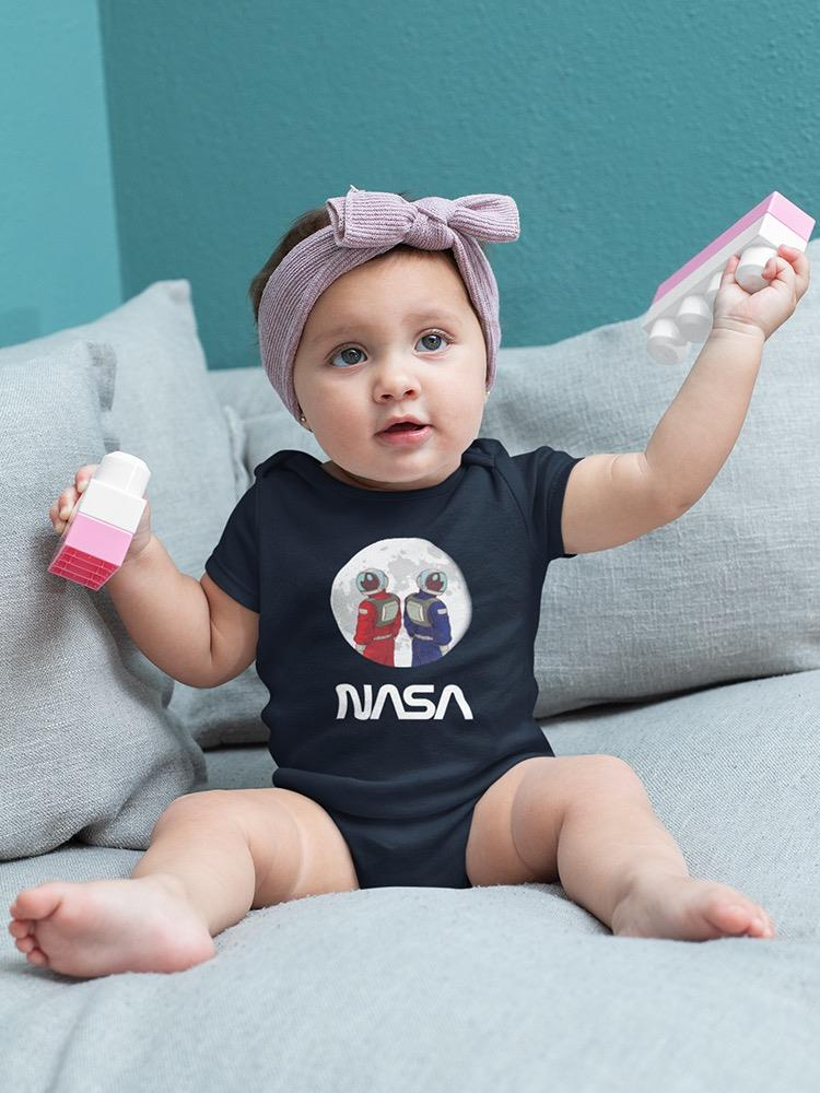 a baby holding a toy