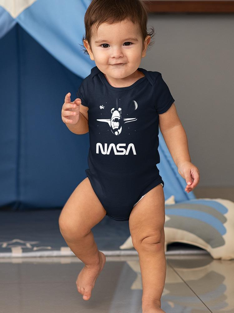 a baby standing on one foot
