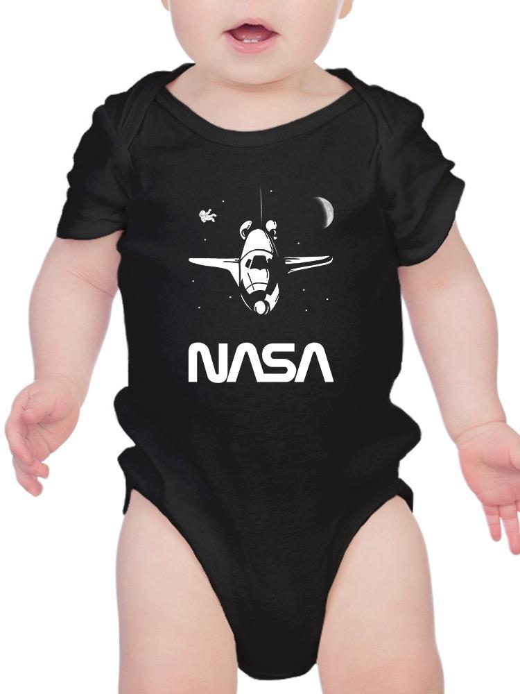 a baby in a black bodysuit