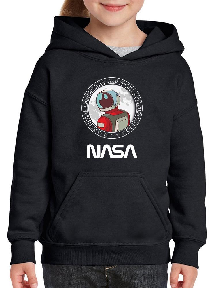 a person wearing a black hoodie with a space suit