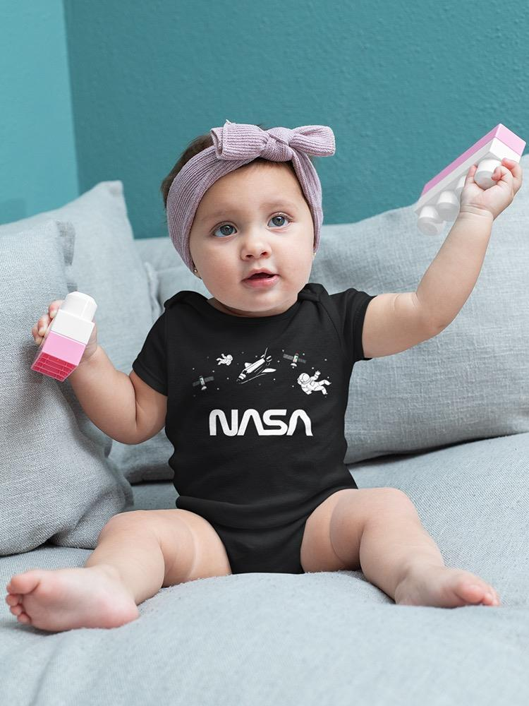 a baby holding a toy