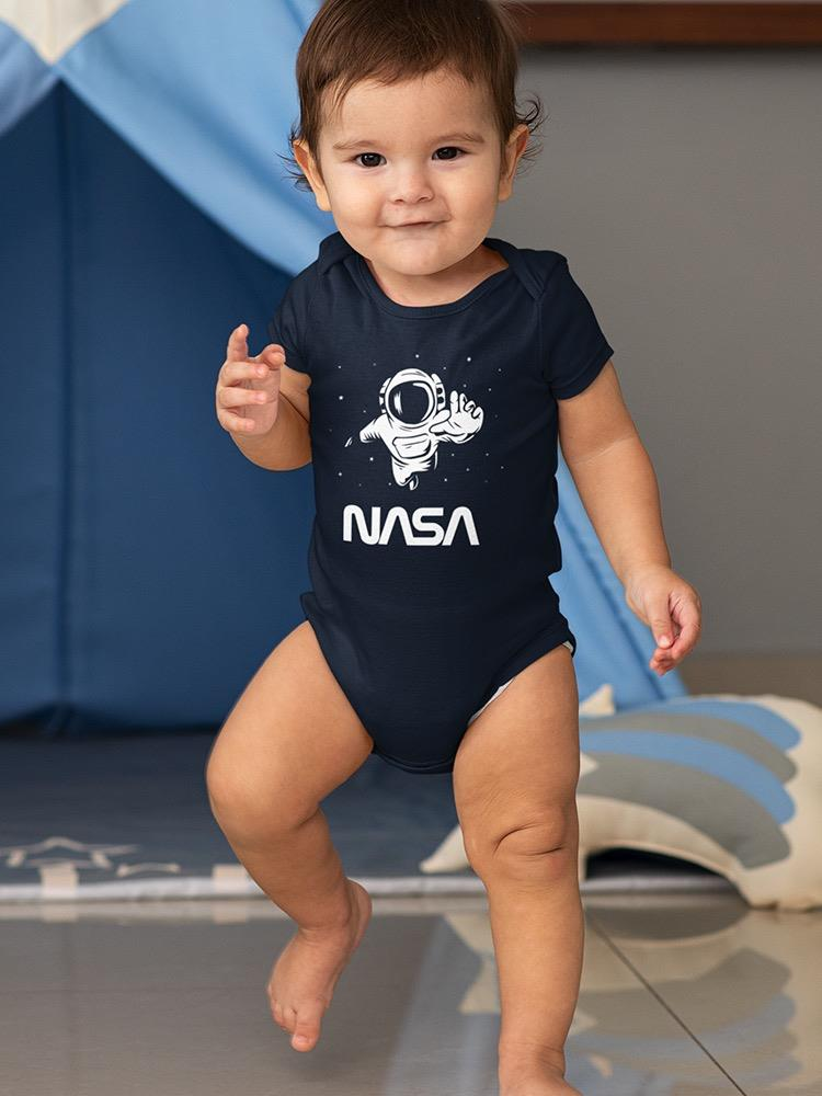 a baby standing on one foot