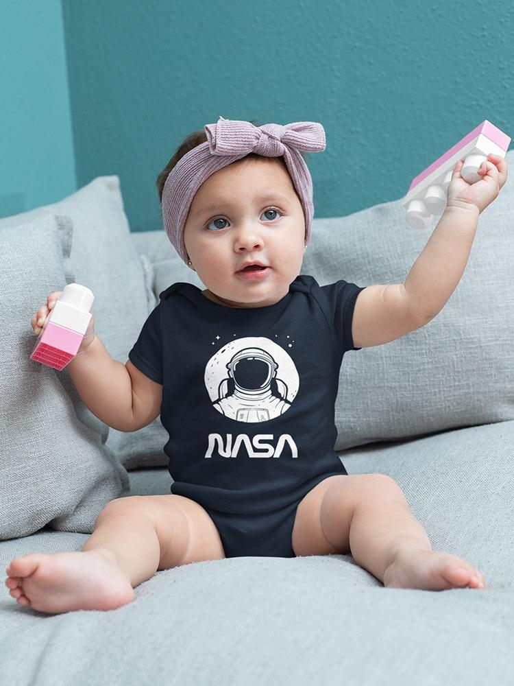 a baby holding a toy