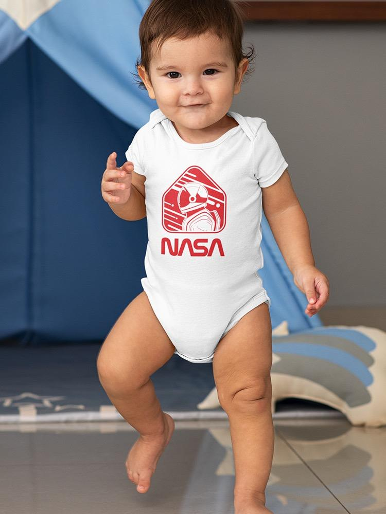 a baby standing on one foot