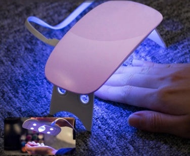 a uv lamp on a hand